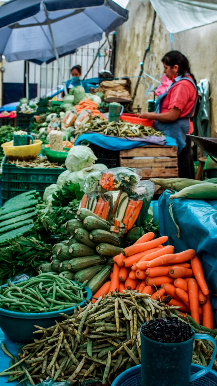 Colorful produce and local sellers at a bustling Mexican farmers market.